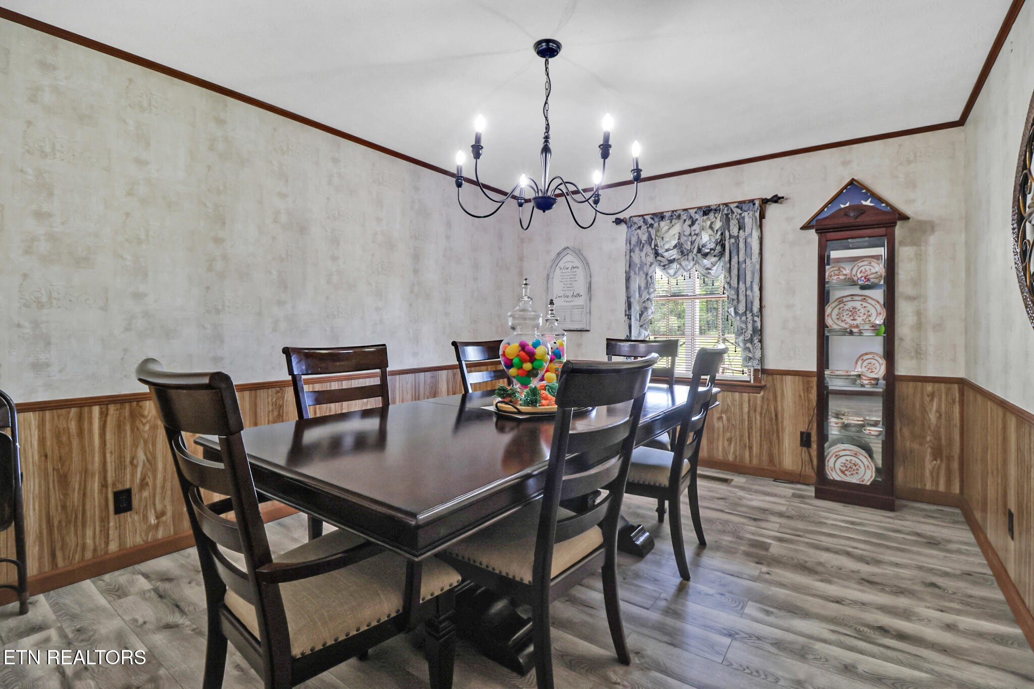 220 Old Gatewood Ford Road Jamestown, TN 38556 - Photo 23 of 57 a view of a dining room with furniture and wooden floor