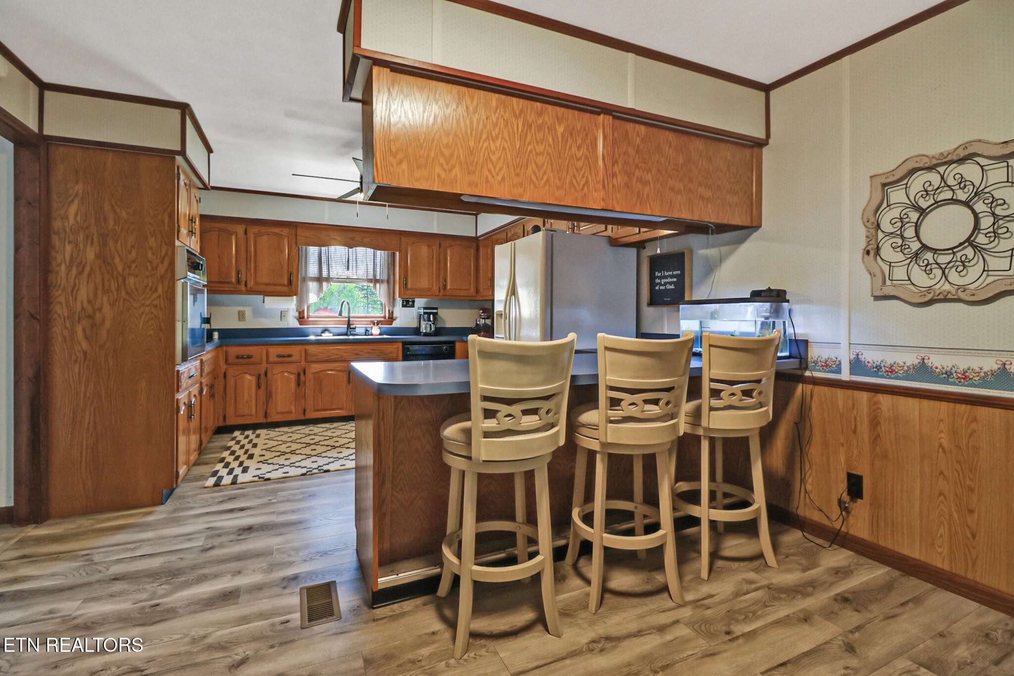 220 Old Gatewood Ford Road Jamestown, TN 38556 - Photo 24 of 57 a dining table with chairs and wooden floor