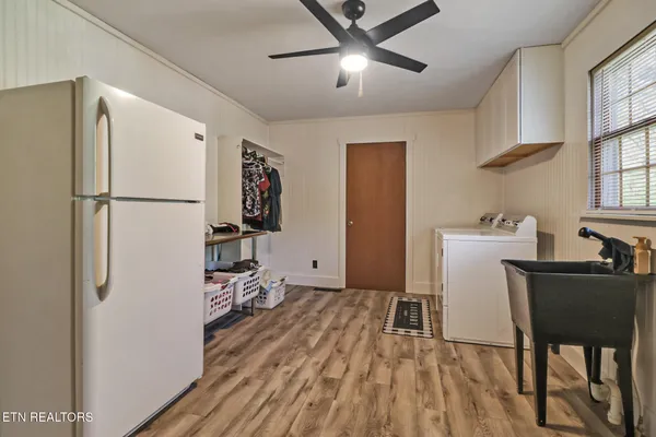 a bedroom with a bed and a table