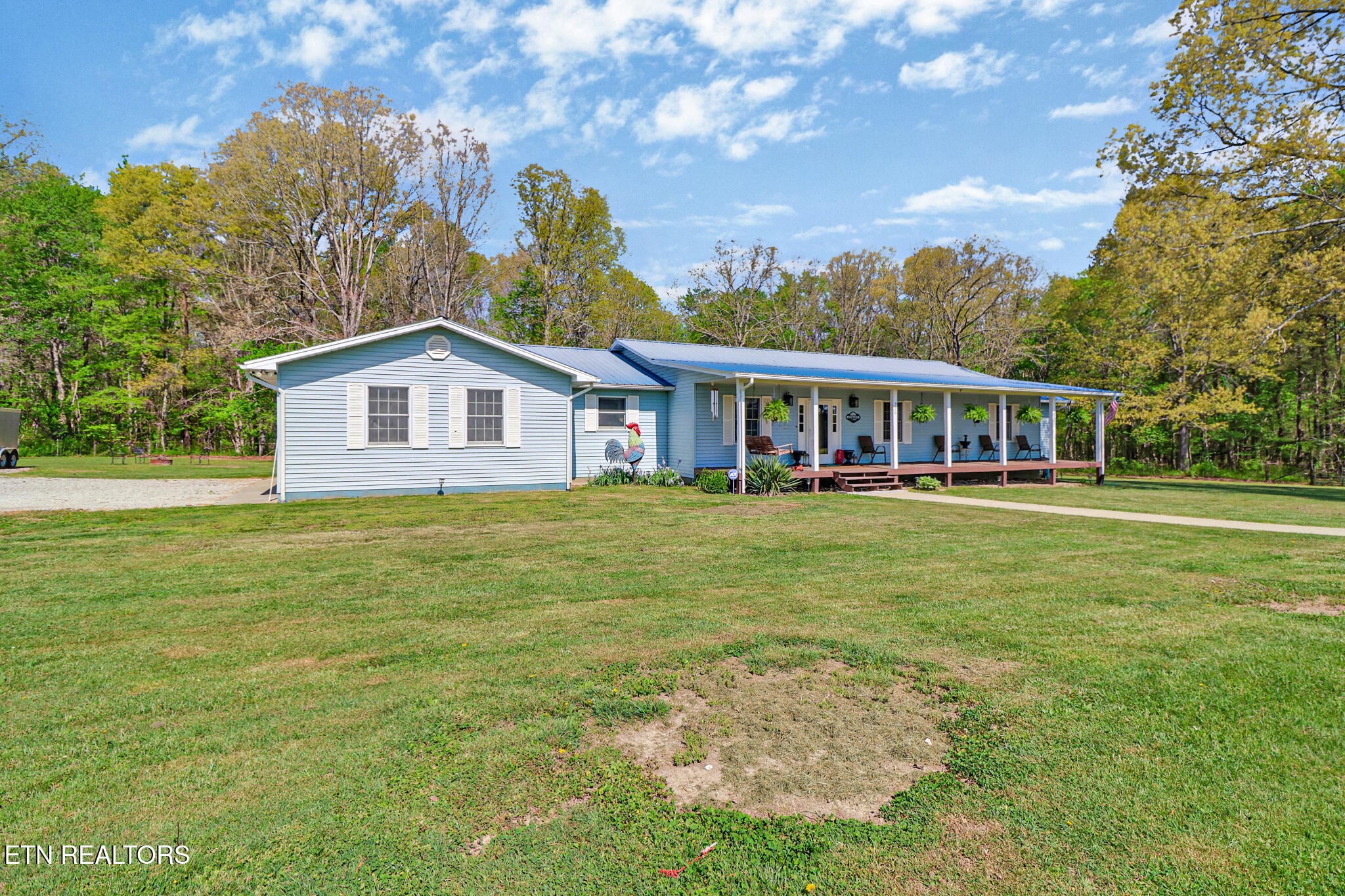 220 Old Gatewood Ford Road Jamestown, TN 38556 - Photo 3 of 57 a view of a house with a yard table and chairs