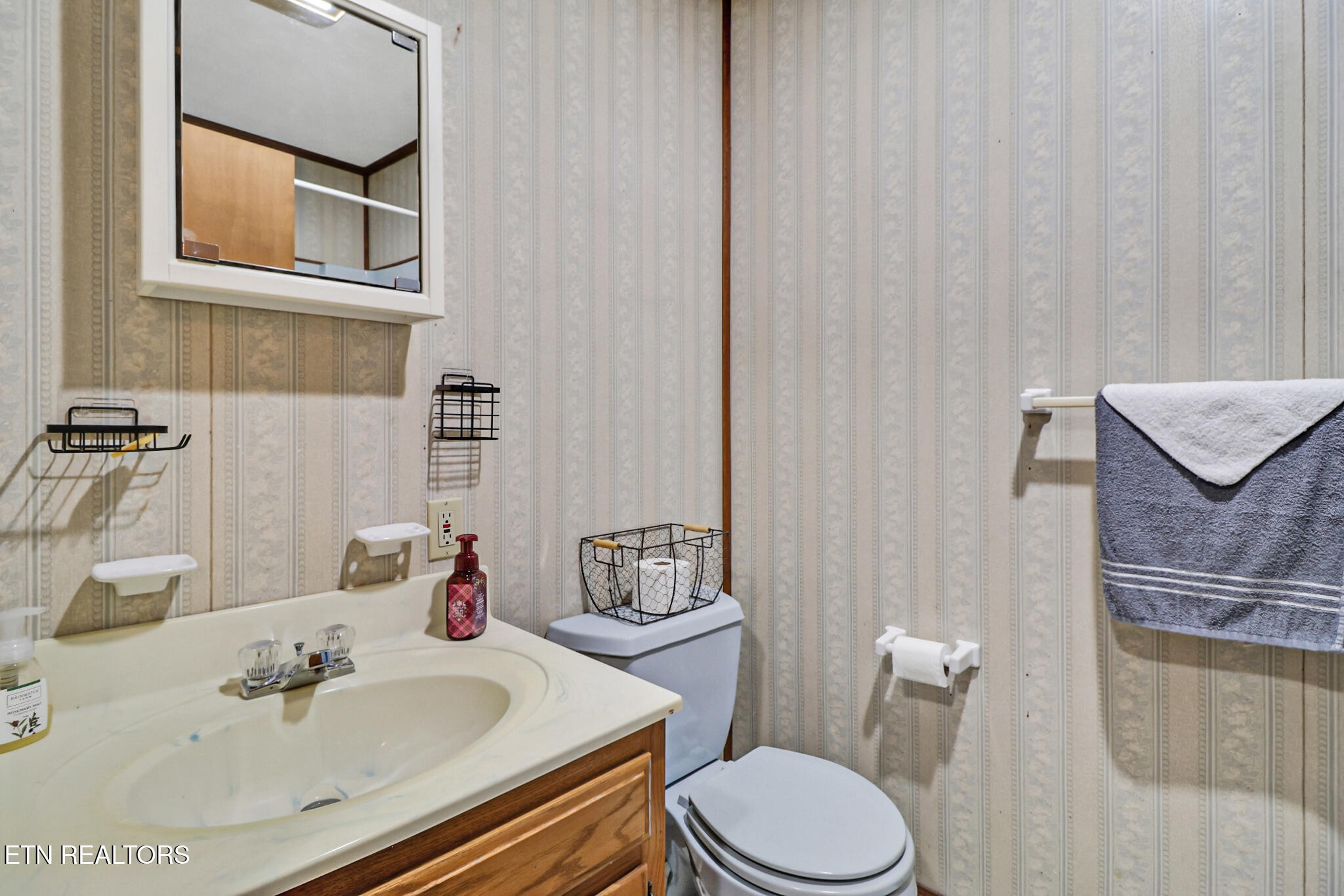 220 Old Gatewood Ford Road Jamestown, TN 38556 - Photo 50 of 57 a bathroom with a sink toilet and mirror