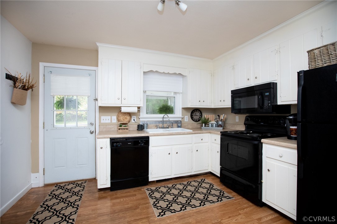 20 Mahan Road Farmville, VA 23901 - Photo 11 of 44 a kitchen with granite countertop a sink stainless steel appliances and white cabinets