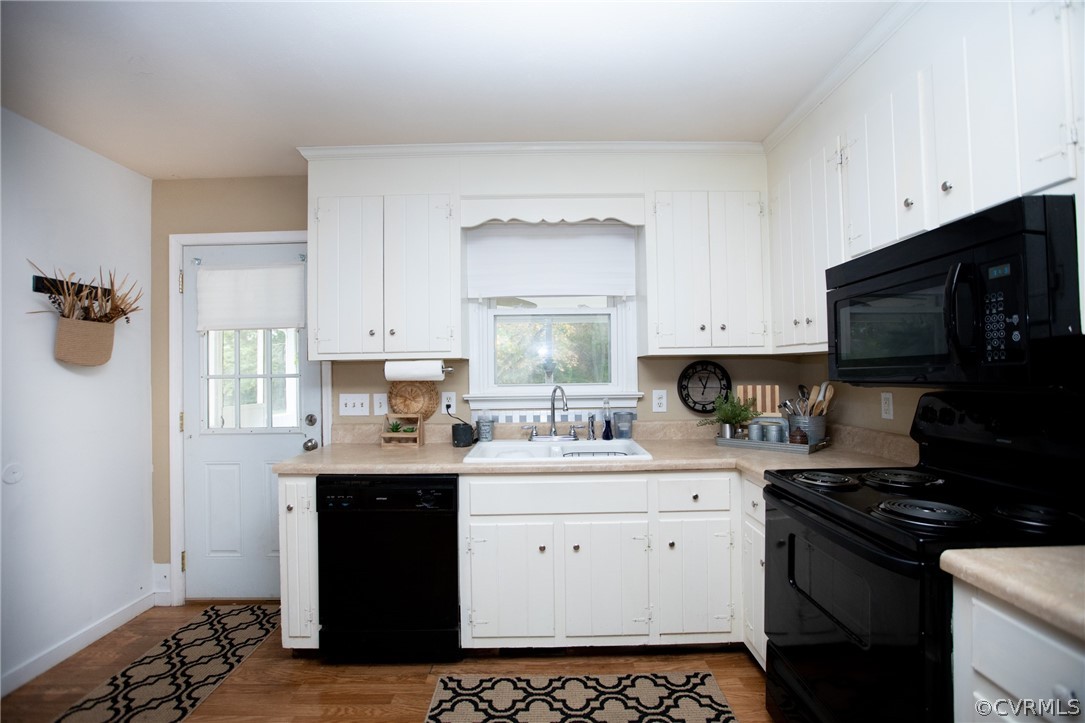 20 Mahan Road Farmville, VA 23901 - Photo 12 of 44 a kitchen with a sink stove top oven and cabinets