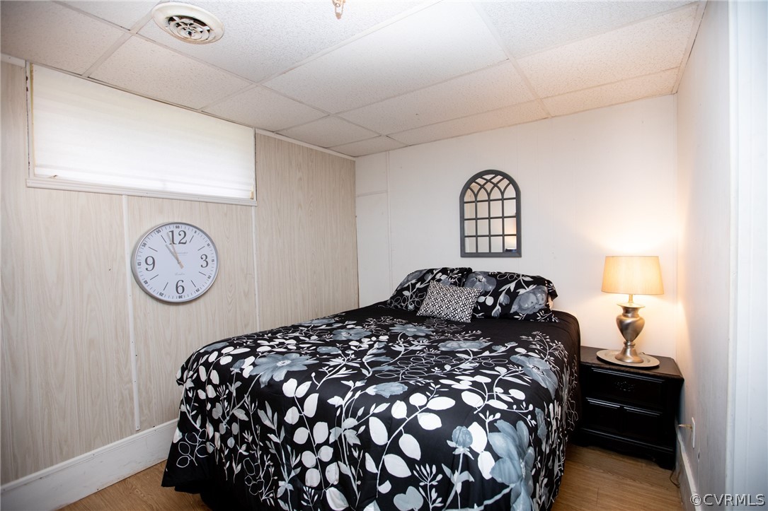 20 Mahan Road Farmville, VA 23901 - Photo 26 of 44 a bedroom with a bed and a lamp on dresser