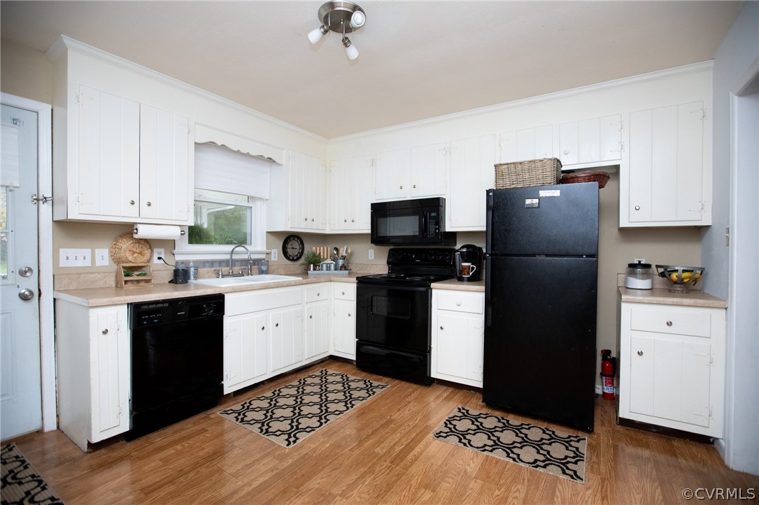 20 Mahan Road Farmville, VA 23901 - Photo 9 of 44 a kitchen with a refrigerator stove and white cabinets