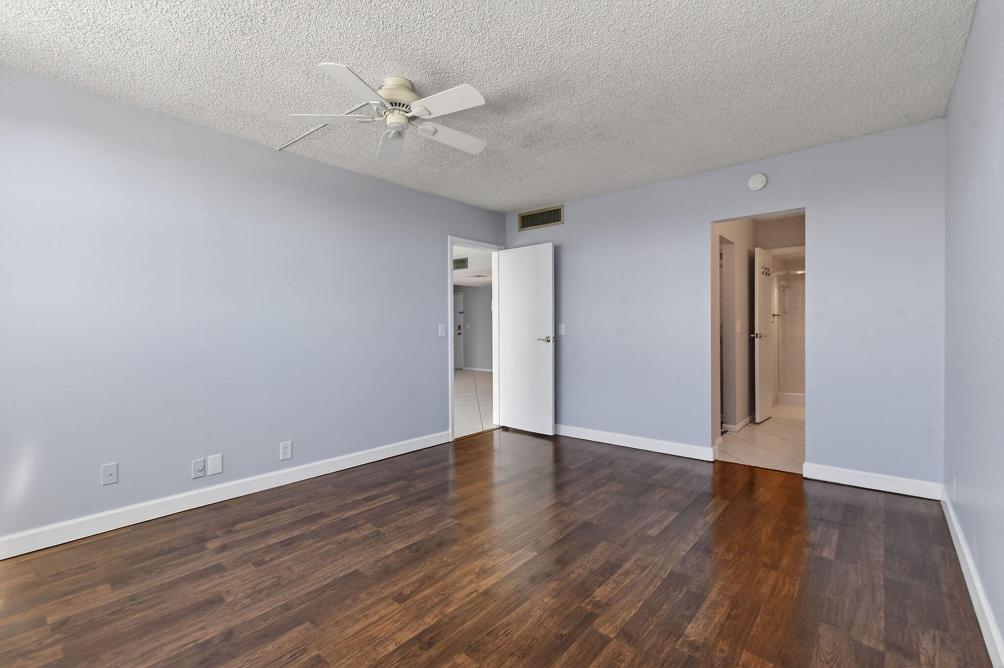 336 Golfview Road, Unit 408 North Palm Beach, FL 33408 - Photo 11 of 39 a view of an empty room with wooden floor
