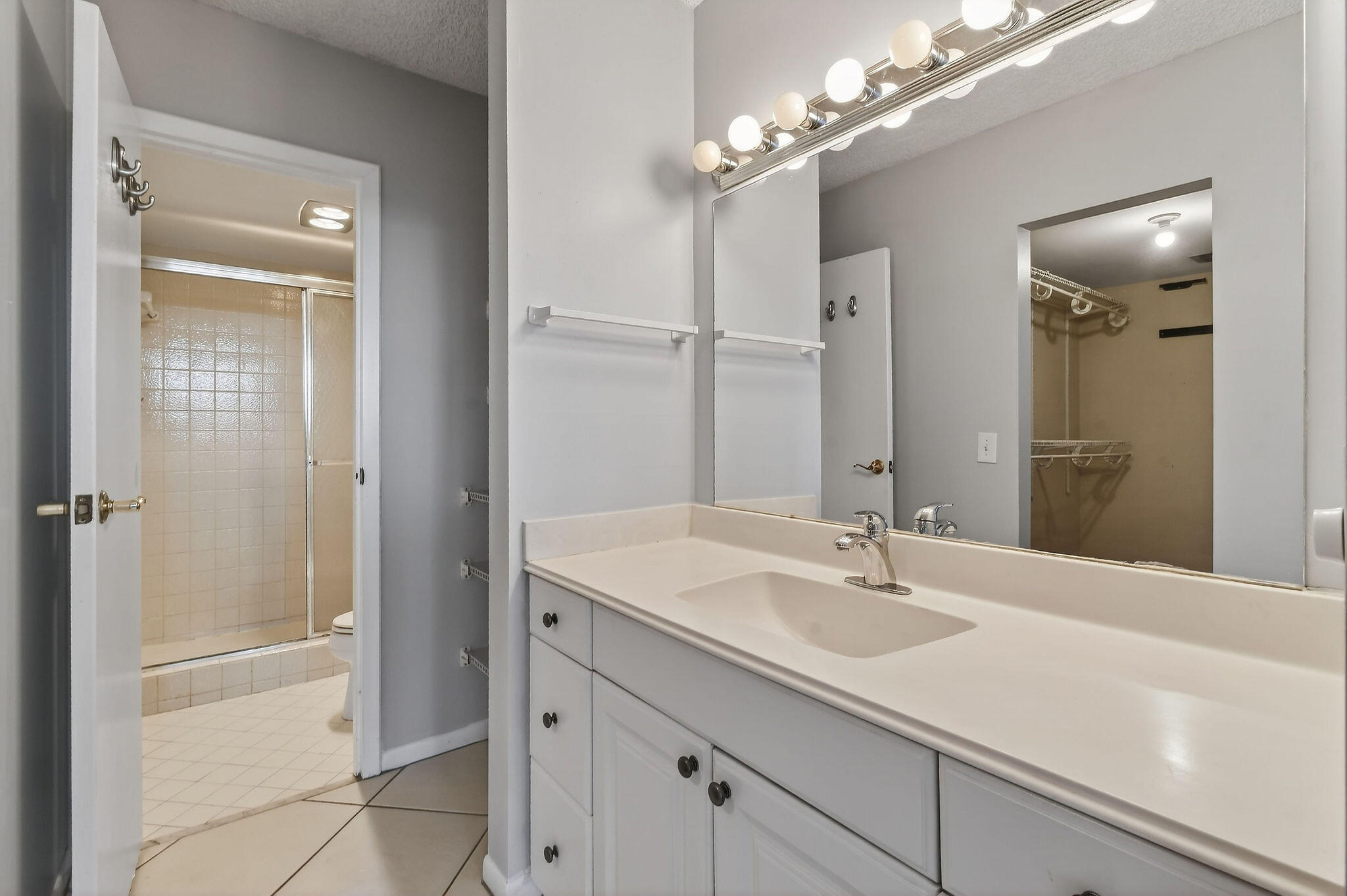 336 Golfview Road, Unit 408 North Palm Beach, FL 33408 - Photo 12 of 39 a bathroom with a sink double vanity and a mirror