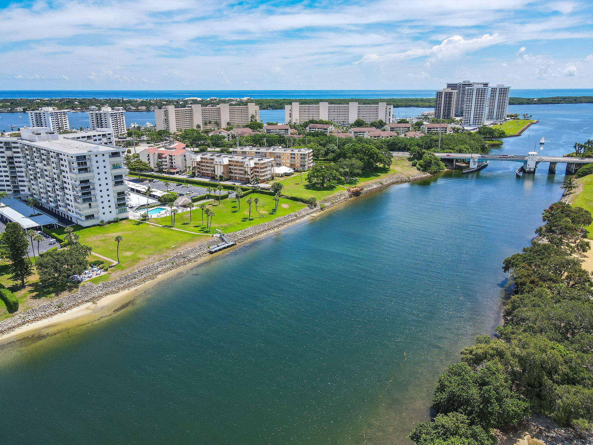 336 Golfview Road, Unit 408 North Palm Beach, FL 33408 - Photo 22 of 39 a view of swimming pool with outdoor seating and a garden