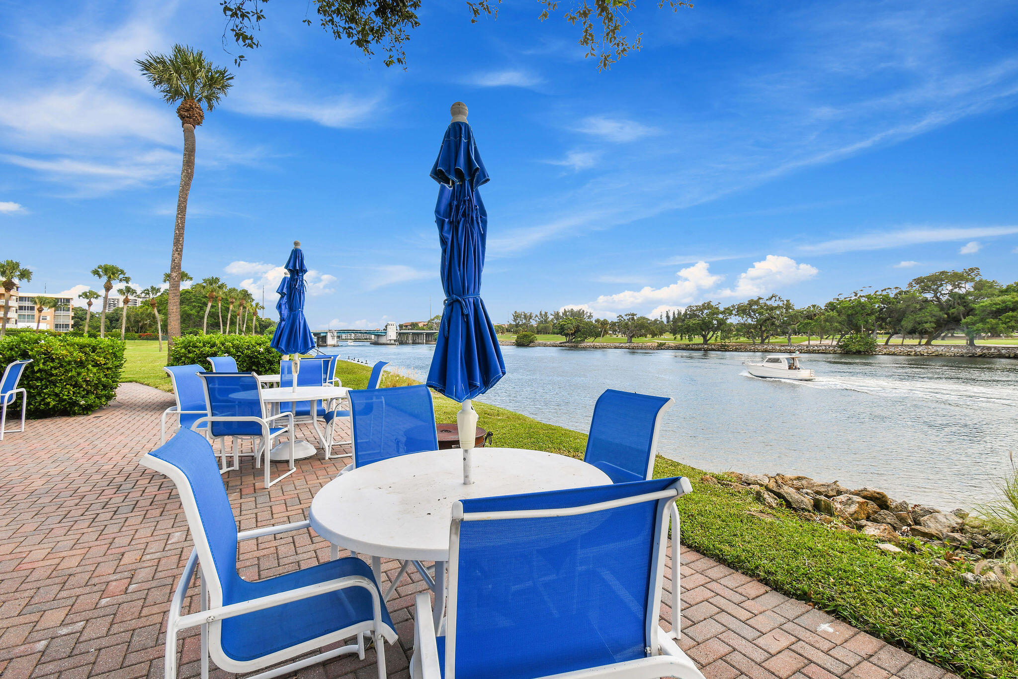 336 Golfview Road, Unit 408 North Palm Beach, FL 33408 - Photo 28 of 39 a view of a patio with swimming pool table and chairs
