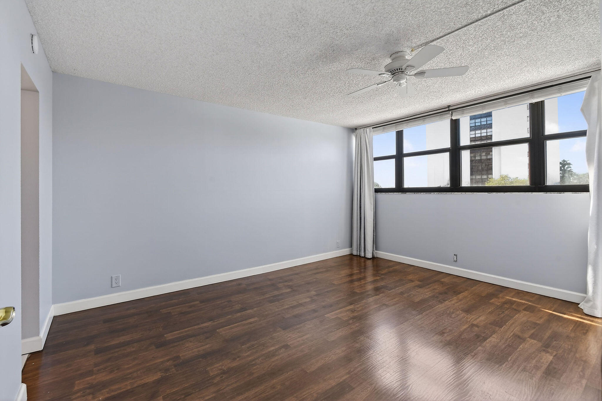 336 Golfview Road, Unit 408 North Palm Beach, FL 33408 - Photo 9 of 39 wooden floor in an empty room