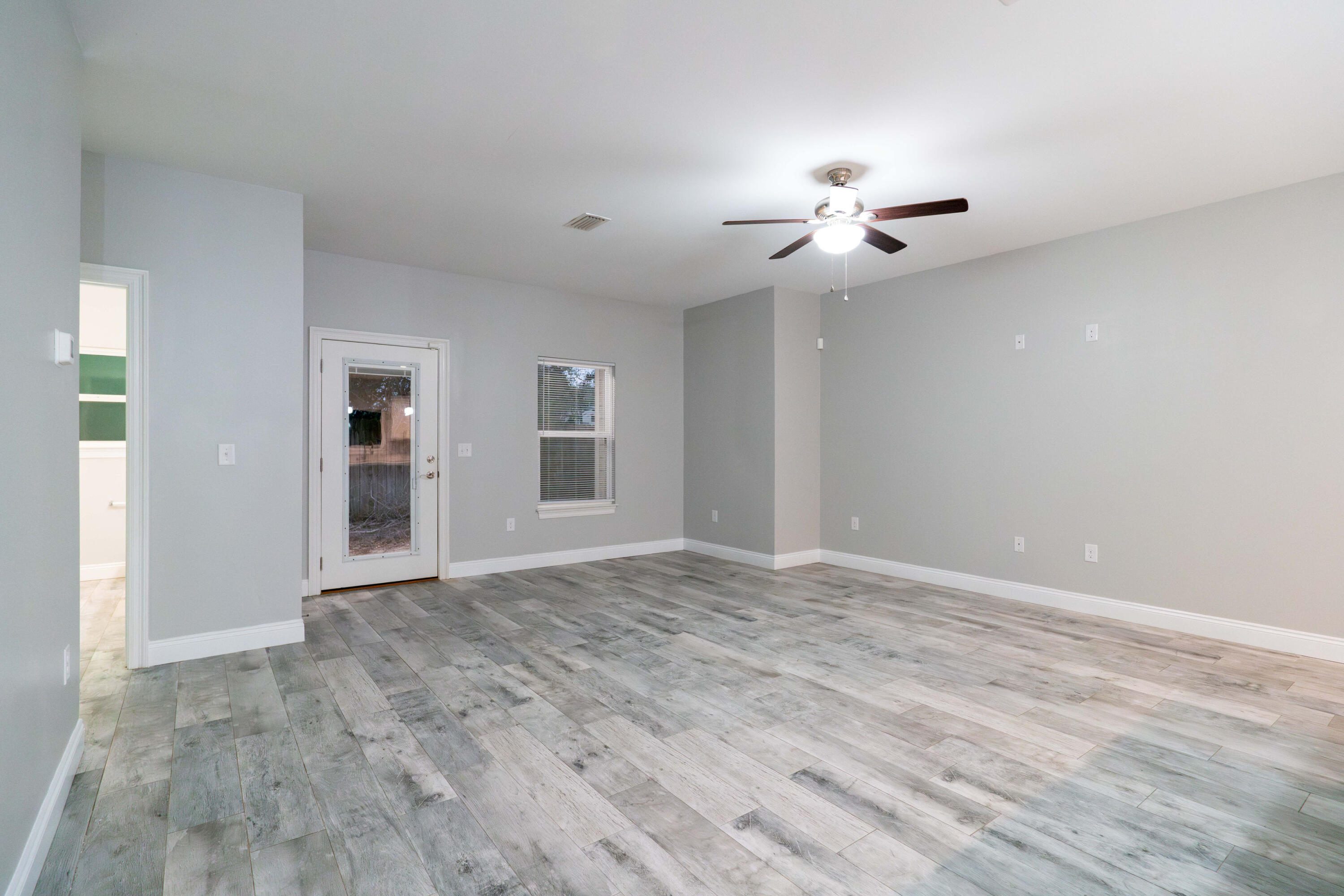 2243 Wind Trace Road North Navarre, FL 32566 - Photo 6 of 34 a view of an empty room with a window