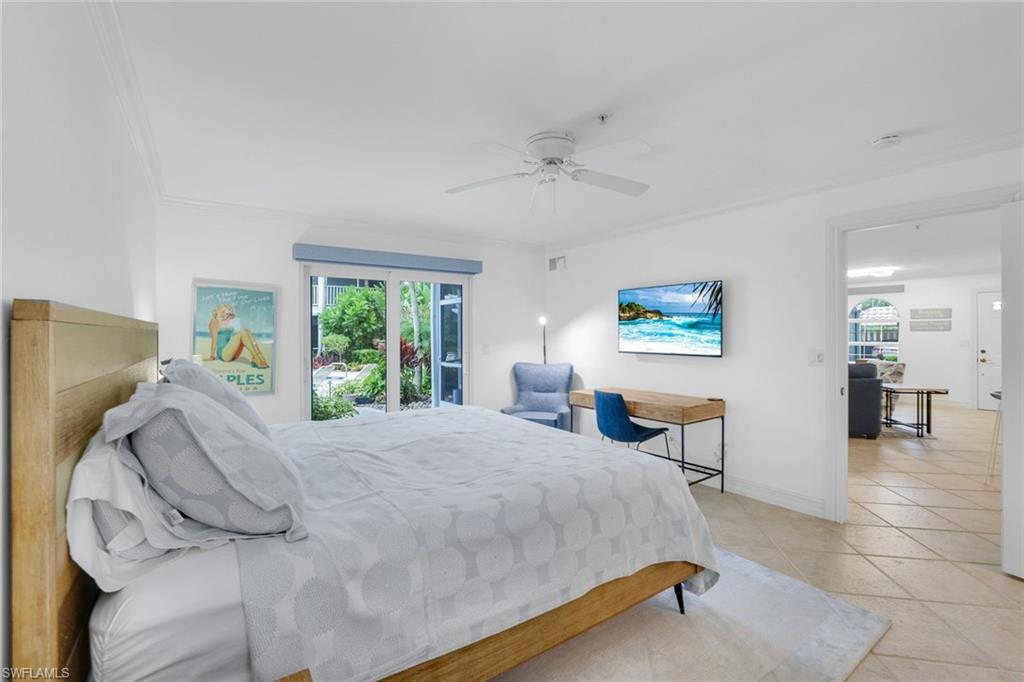 376 3rd Street South, Unit 102 Naples, FL 34102 - Photo 11 of 17 Bedroom with a ceiling fan, light tile patterned flooring, access to exterior, and crown molding