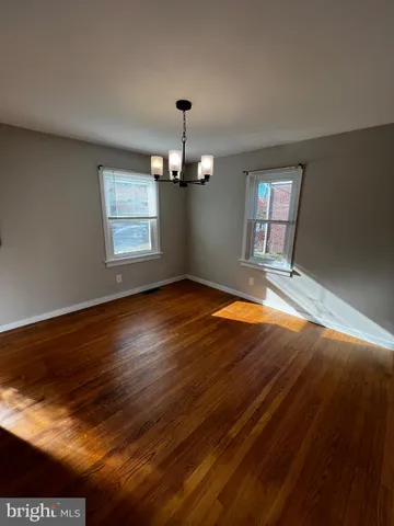 a view of livingroom with window and hardwood floor