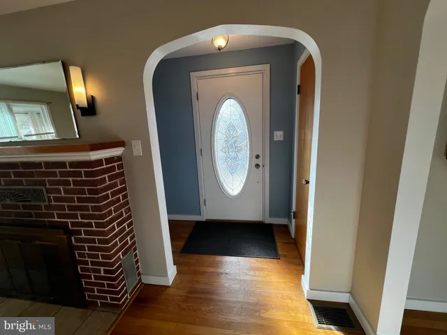 a view of front door with wooden floor