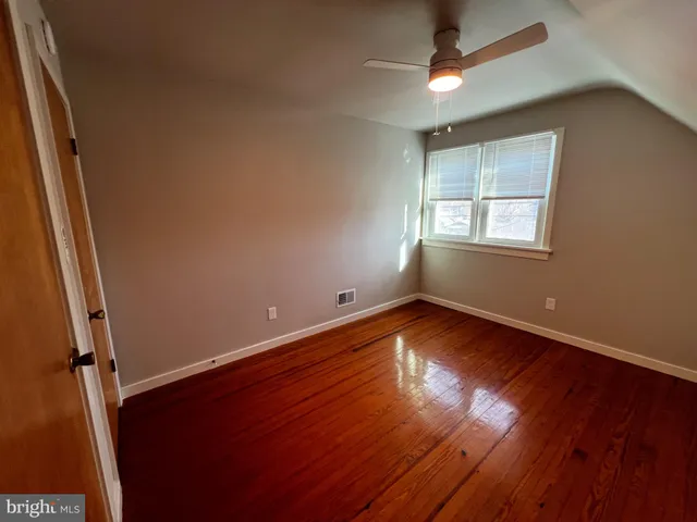 a view of bathroom with a sink and mirror