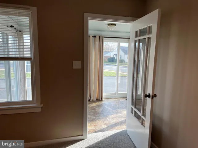a view of a glass door and a living room