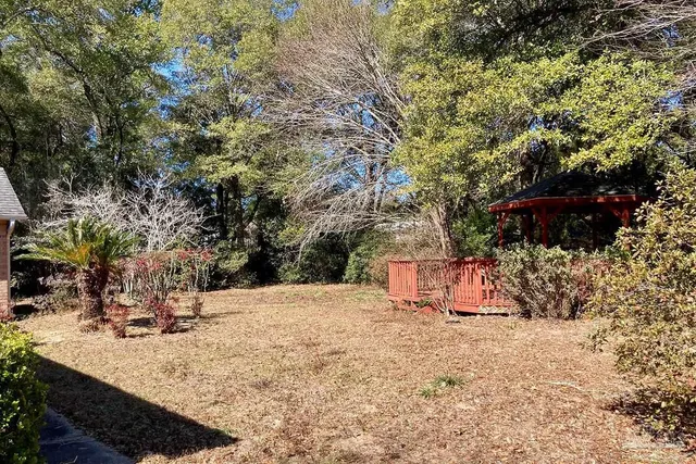 a view of a covered with snow in front of house
