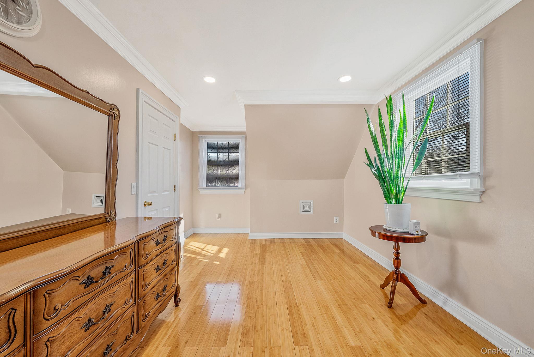 20 Howe Road Coram, NY 11727 - Photo 14 of 25 a view of a room with gym equipment and wooden floor