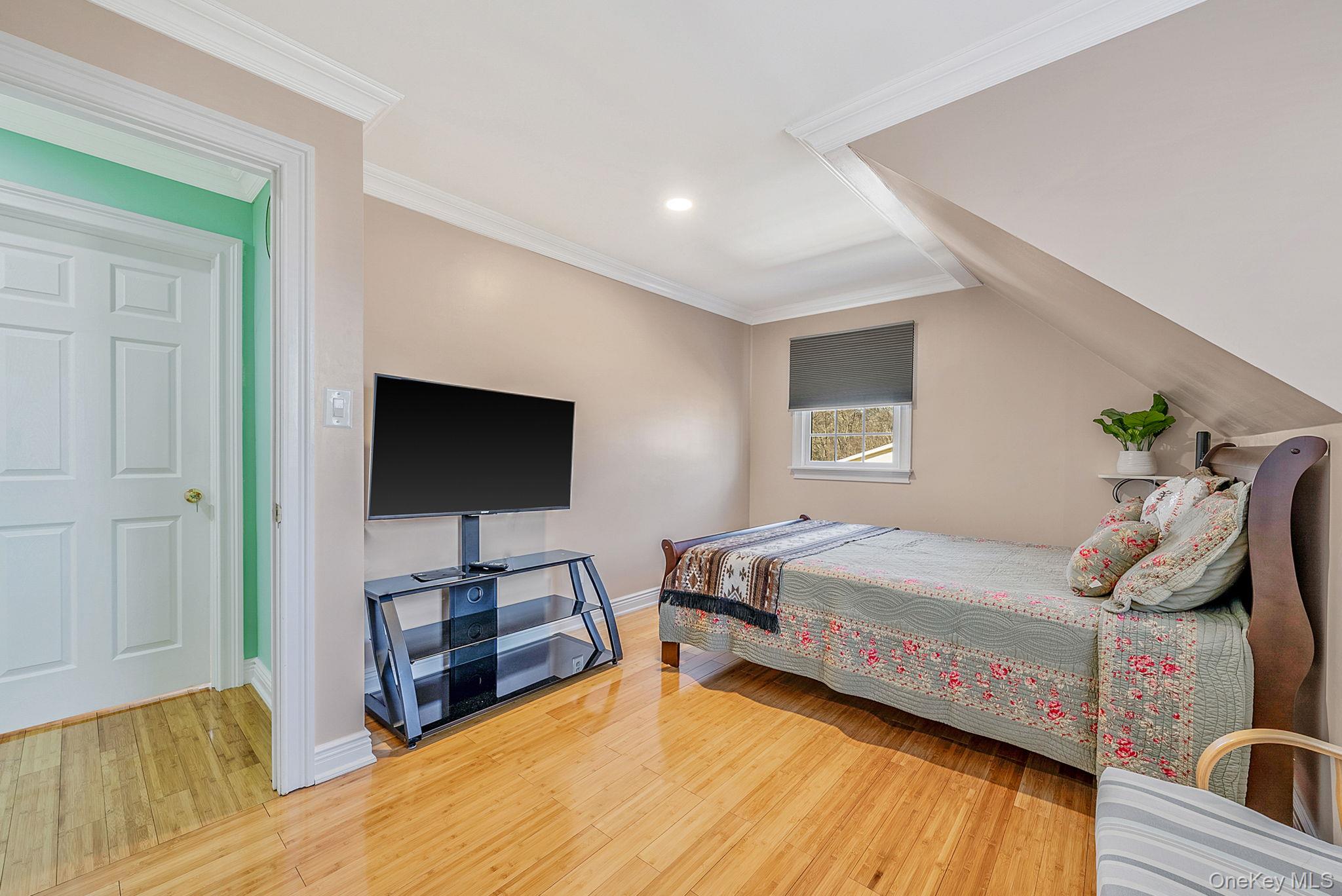 20 Howe Road Coram, NY 11727 - Photo 15 of 25 a bedroom with a bed and a flat screen tv