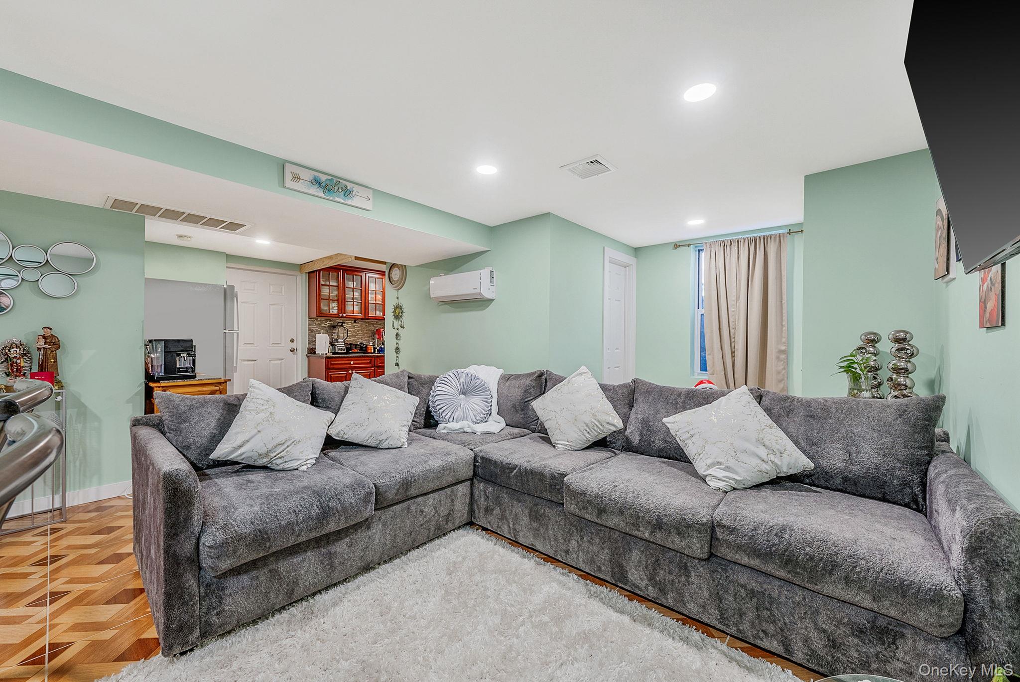 20 Howe Road Coram, NY 11727 - Photo 18 of 25 a living room with furniture and a couch