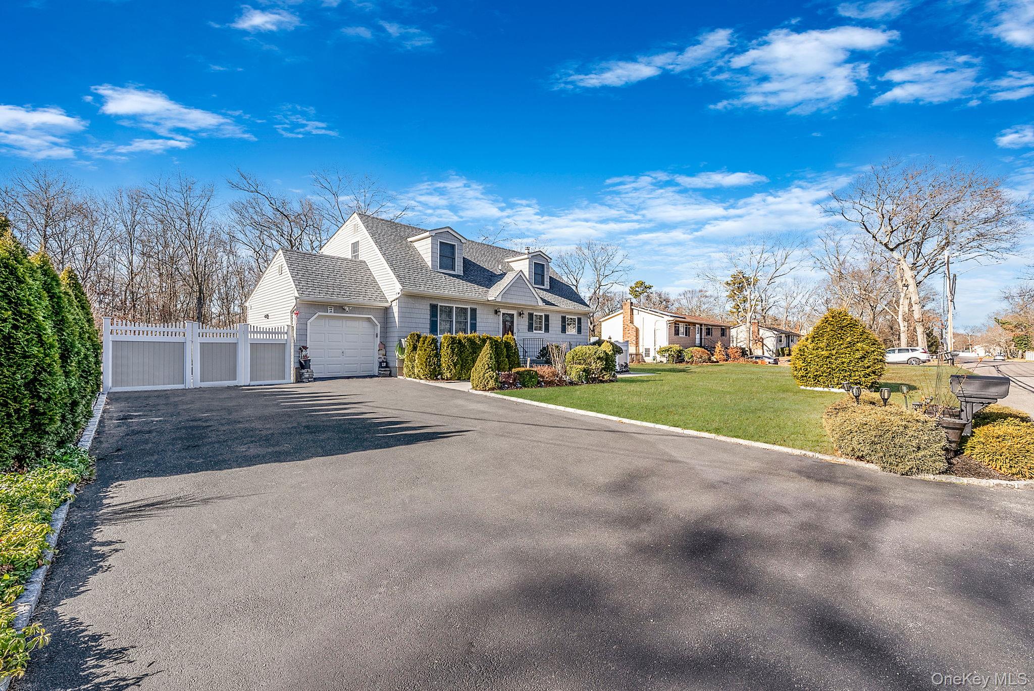 20 Howe Road Coram, NY 11727 - Photo 3 of 25 a view of an house with backyard and a tree