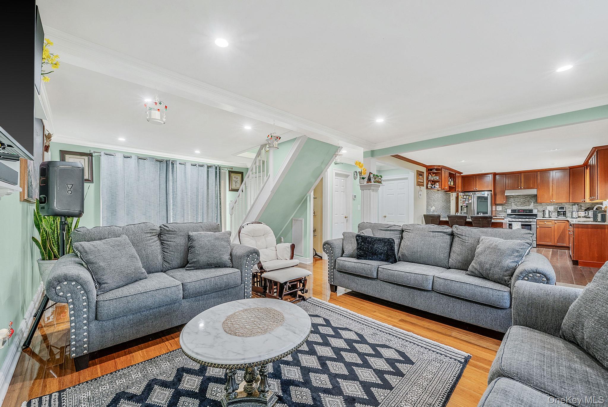 20 Howe Road Coram, NY 11727 - Photo 5 of 25 a living room with furniture and kitchen view