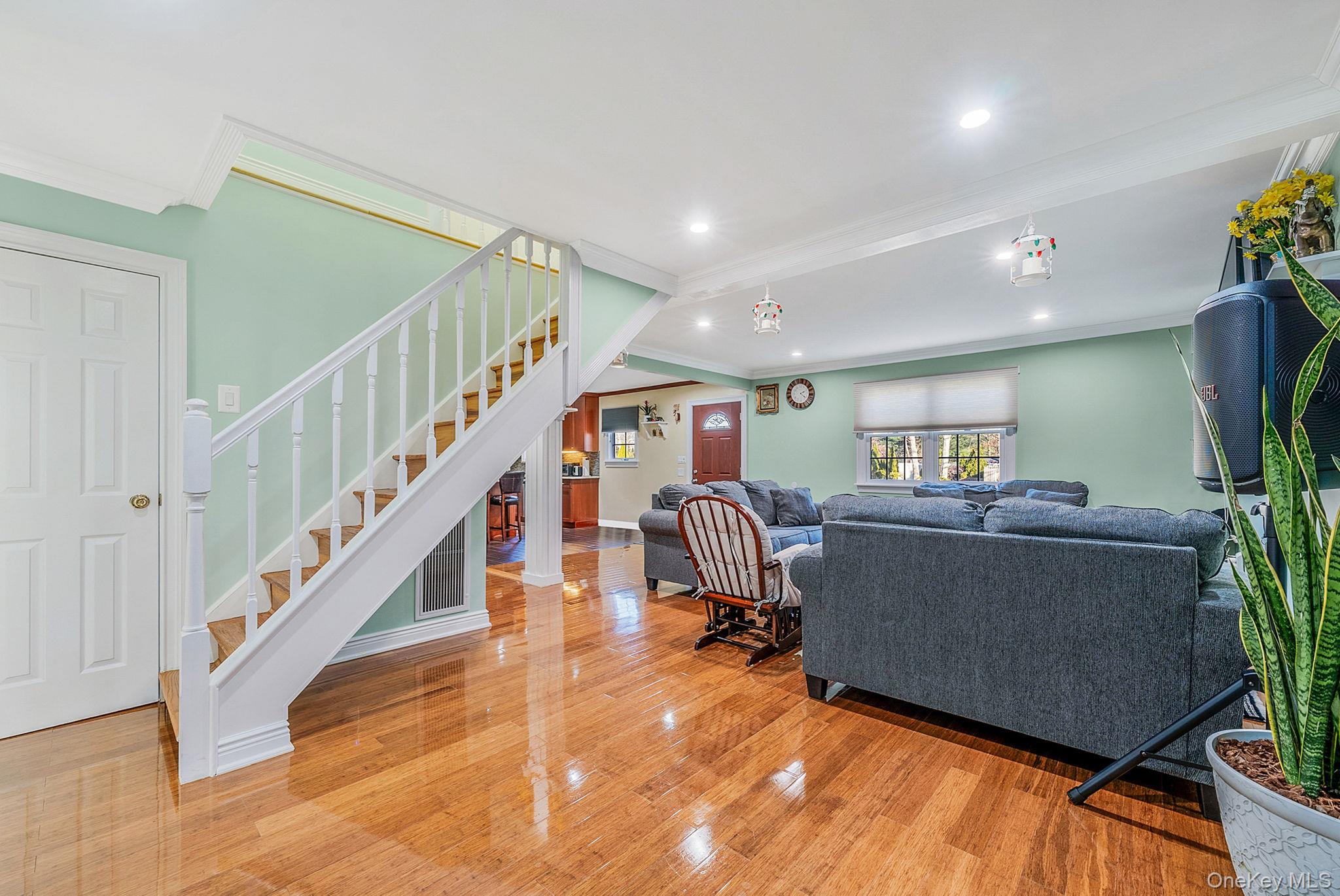 20 Howe Road Coram, NY 11727 - Photo 6 of 25 a living room with furniture and a flat screen tv
