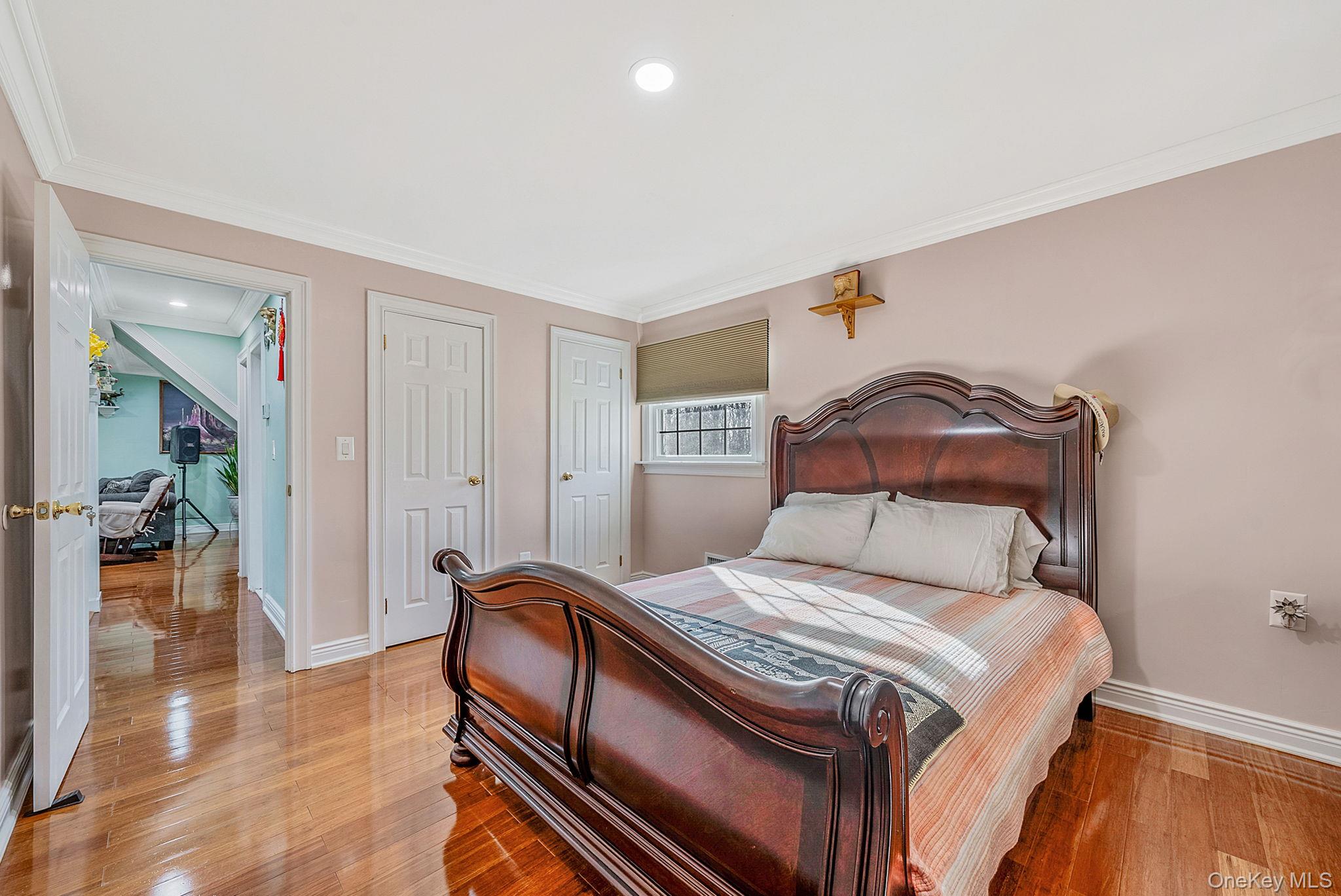 20 Howe Road Coram, NY 11727 - Photo 10 of 25 a bedroom with a bed and a view of bathroom