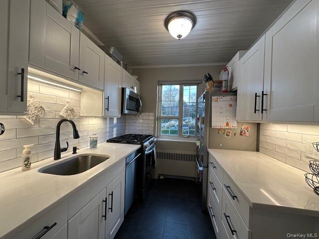 415 Main Street, Unit 101B Huntington, NY 11743 - Photo 2 of 10 a kitchen that has a sink and a stove