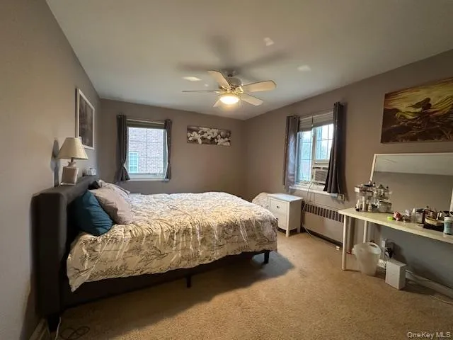 a bedroom with bed and window