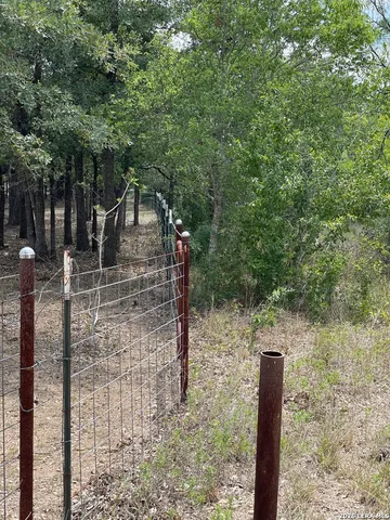 a pathway of a house with a yard
