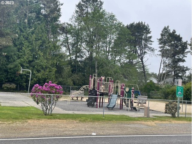 Munsel Lake, Unit TL100 Florence, OR 97439 - Photo 16 of 20 a patio with glass top table and chairs
