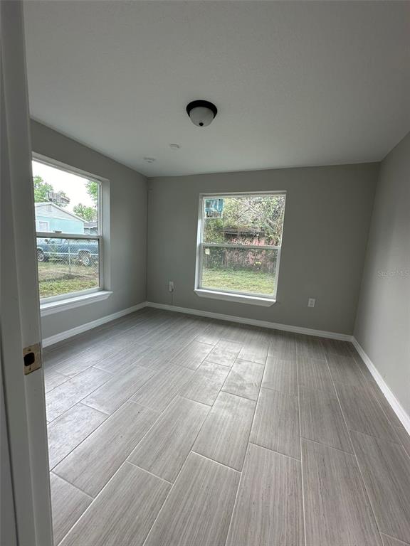 2015 Laurel Street Bartow, FL 33830 - Photo 14 of 18 an empty room with wooden floor and windows