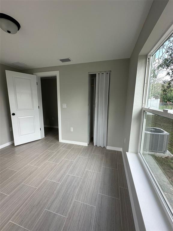 2015 Laurel Street Bartow, FL 33830 - Photo 9 of 18 wooden floor in an empty room with a window