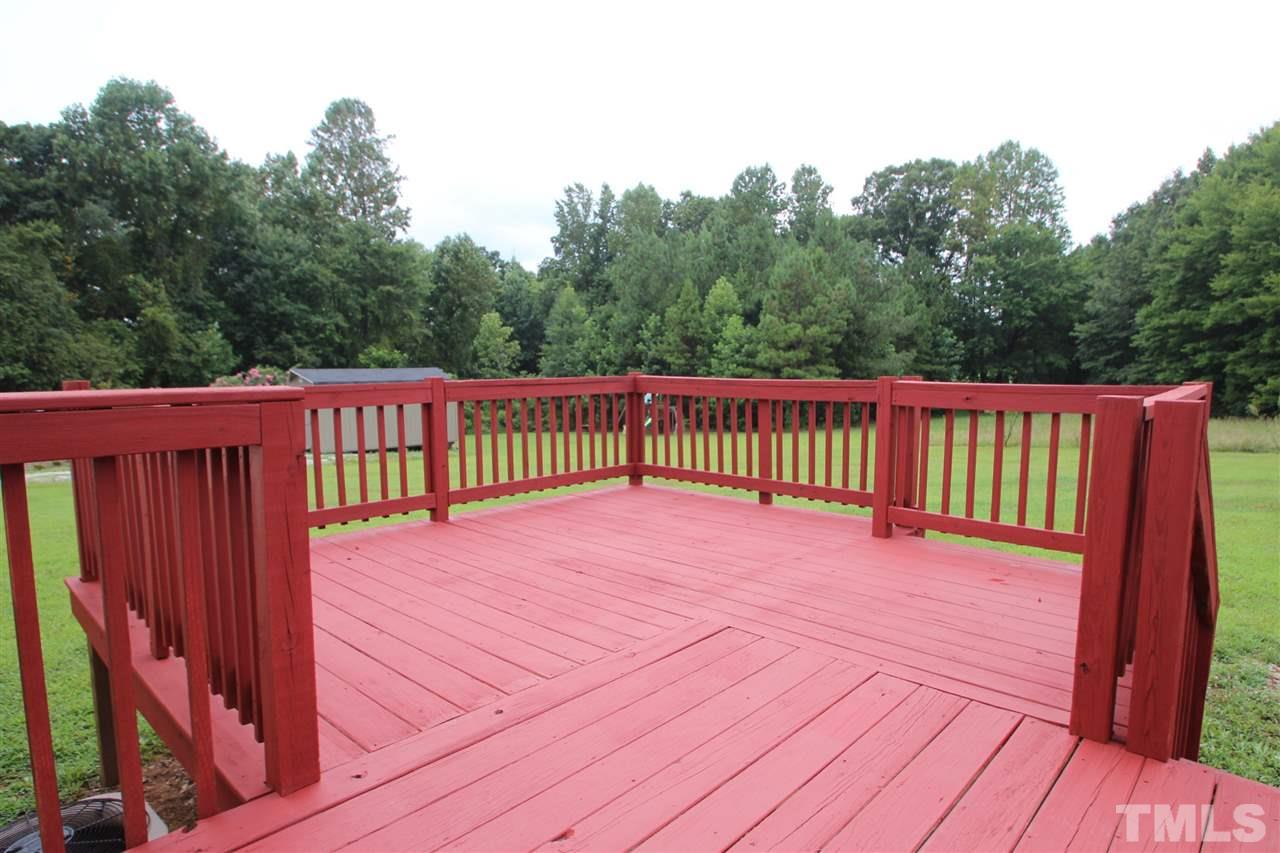 400 Neal's Store Road Roxboro, NC 27574 - Photo 14 of 15 a view of a wooden floor with a wooden fence
