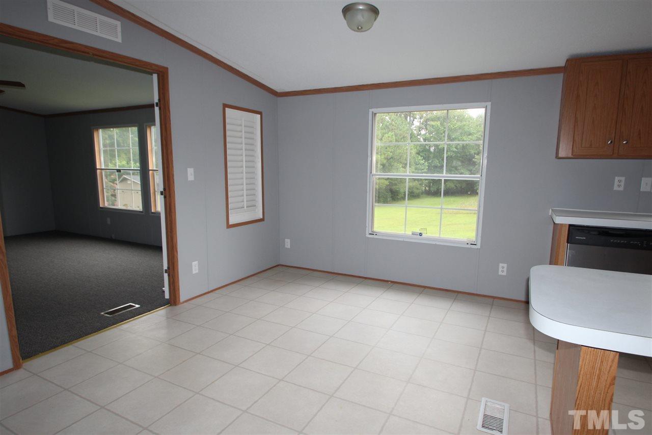 400 Neal's Store Road Roxboro, NC 27574 - Photo 5 of 15 an empty room with windows