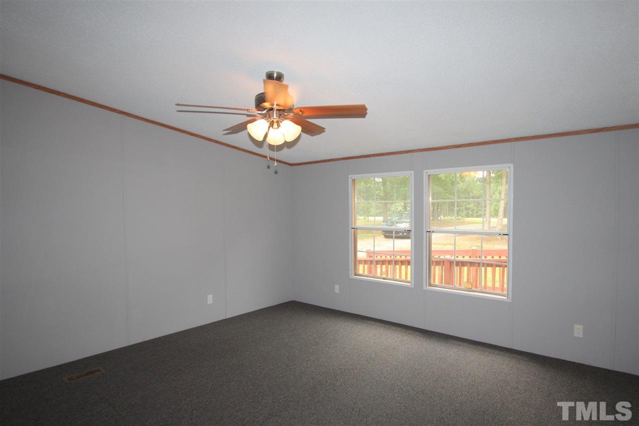 400 Neal's Store Road Roxboro, NC 27574 - Photo 8 of 15 an empty room with a window