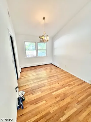 a view of an empty room and a window