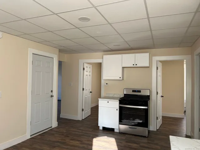 a room with furniture and wooden floor