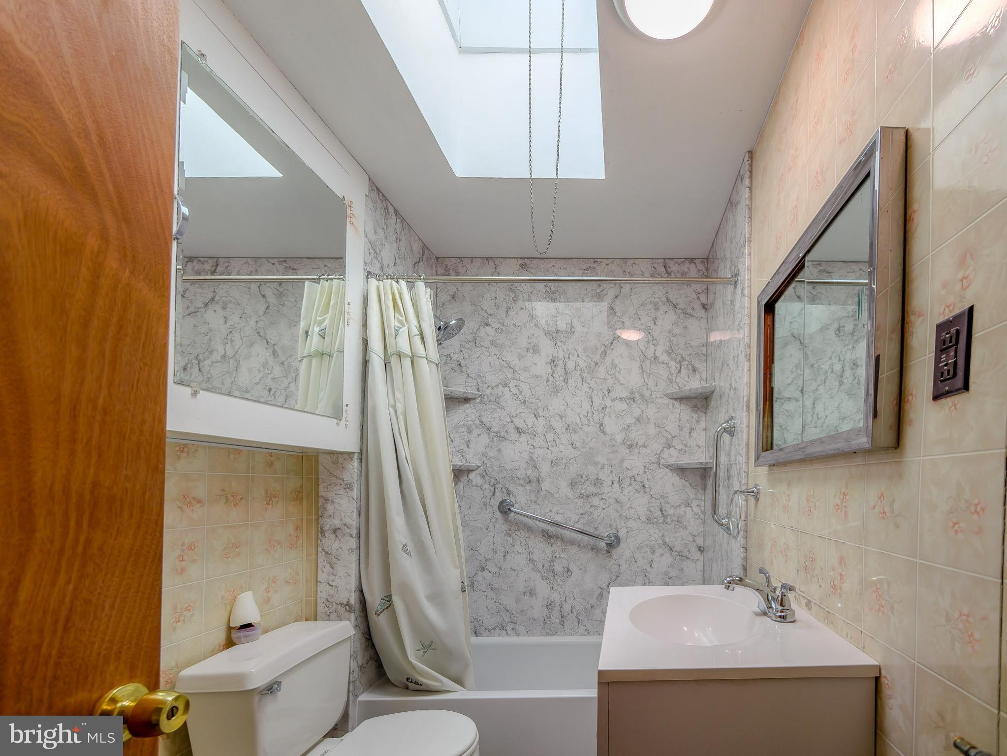 7154 Ruskin Lane Upper Darby, PA 19082 - Photo 14 of 28 a bathroom with a sink a toilet and shower