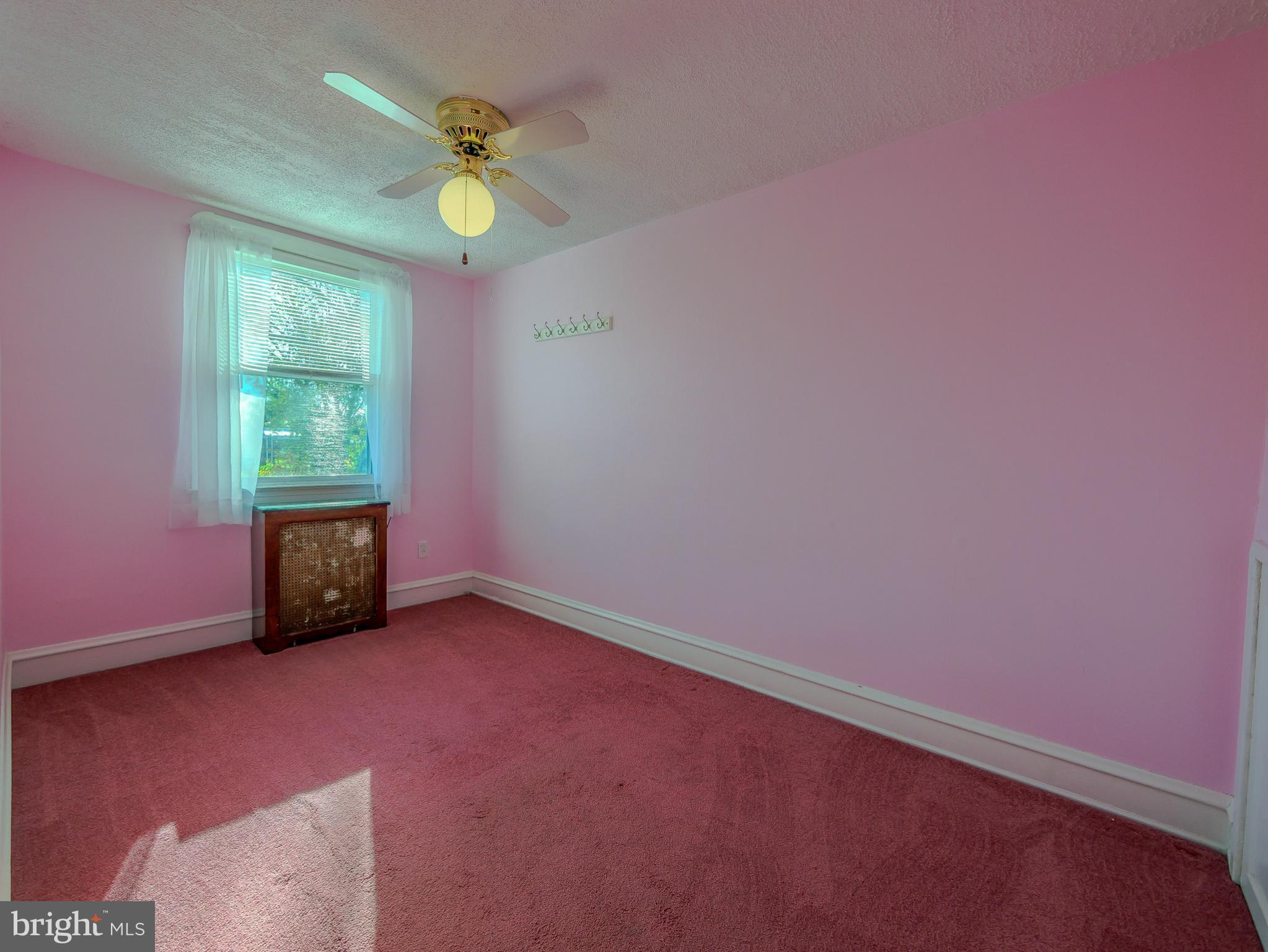 7154 Ruskin Lane Upper Darby, PA 19082 - Photo 15 of 28 an empty room with window and a ceiling fan