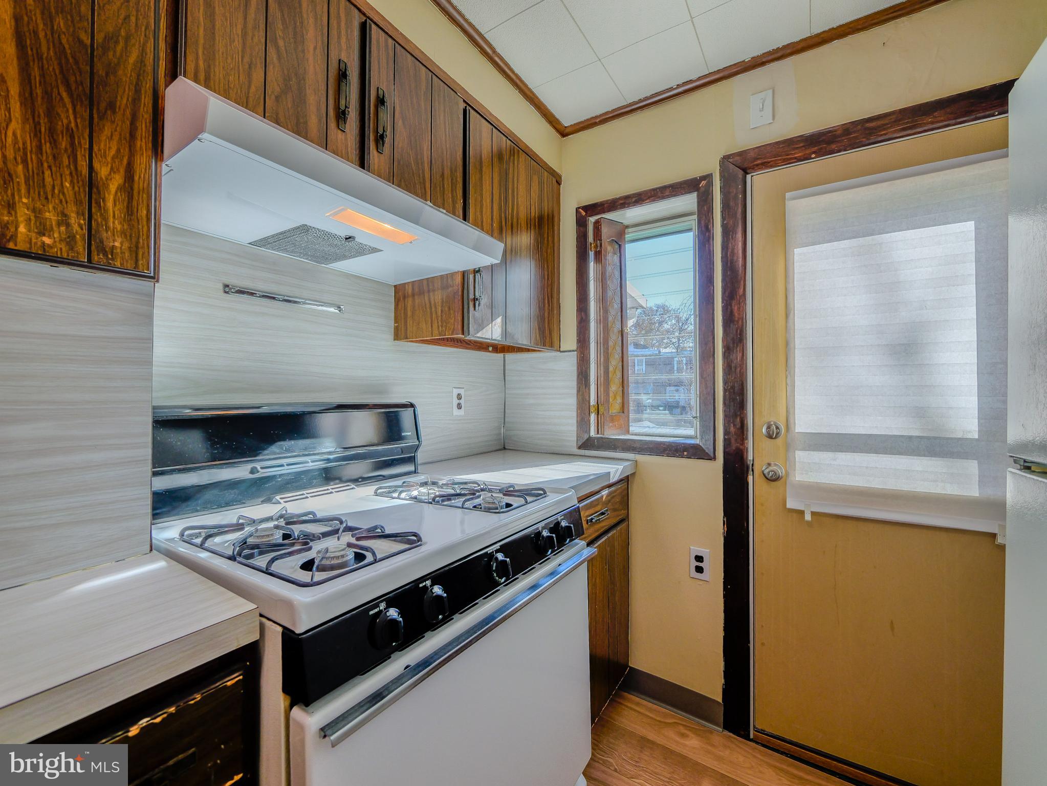 7154 Ruskin Lane Upper Darby, PA 19082 - Photo 8 of 28 a kitchen with a stove and a table