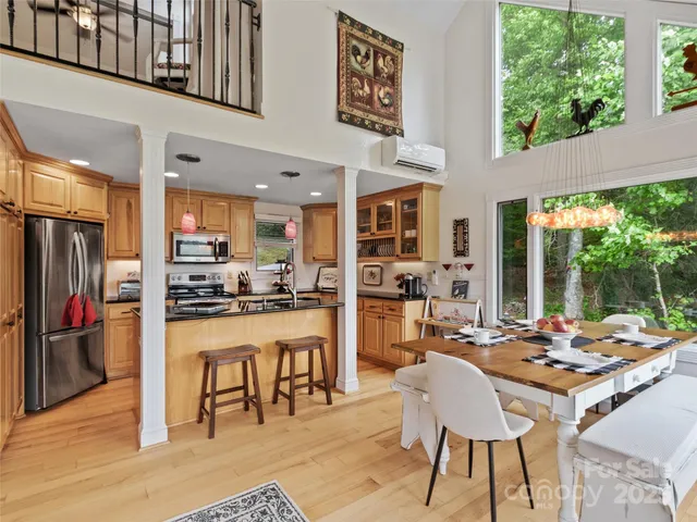 a outdoor dining space with furniture and a kitchen view