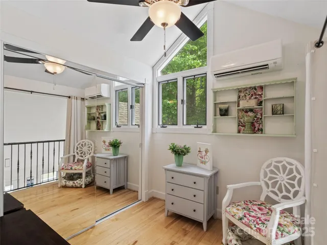 a bedroom with furniture and a window