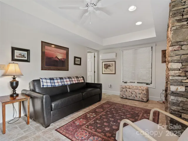 a living room with furniture and a lamp