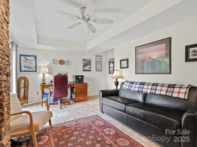 a living room with furniture a couch and dresser
