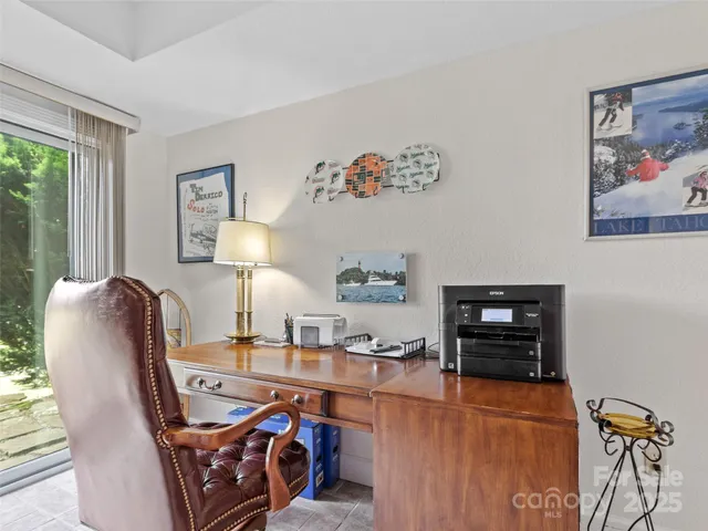 a workspace with furniture and window