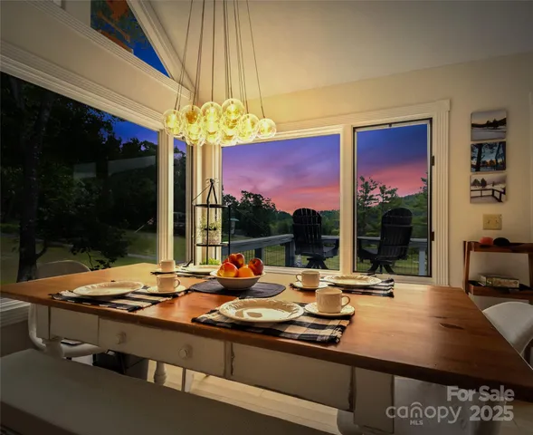 a outdoor kitchen with a table and chairs