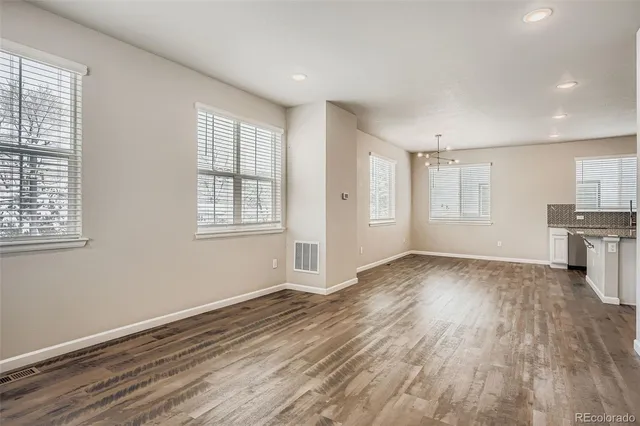 a view of a kitchen with electric equipment and windows