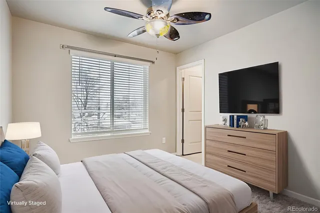 a bathroom with a sink a toilet a mirror and shower